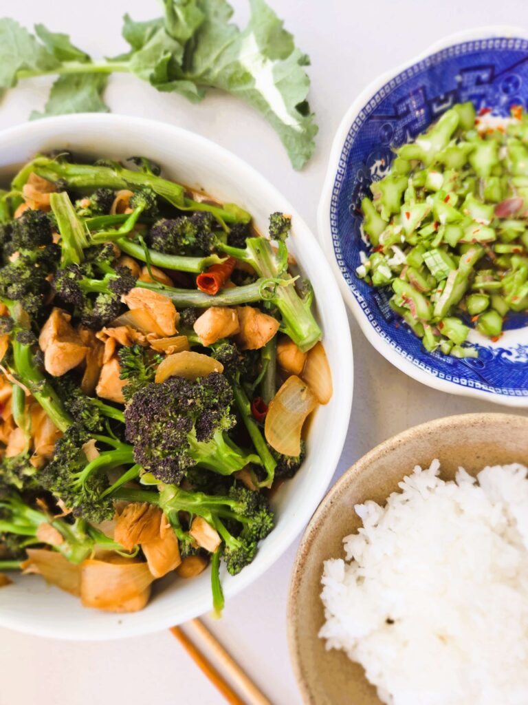 Plated Stir-fried Broccoli Chicken with rice and broccoli stem garnish