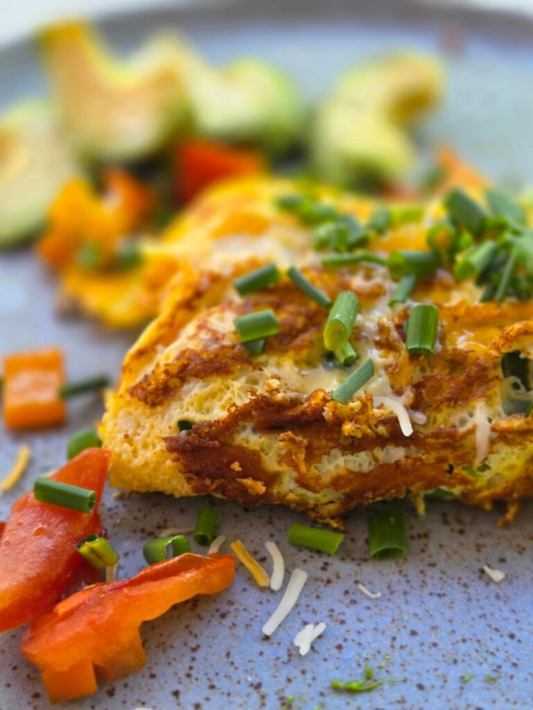 omelette with green onions sprinkled on top
