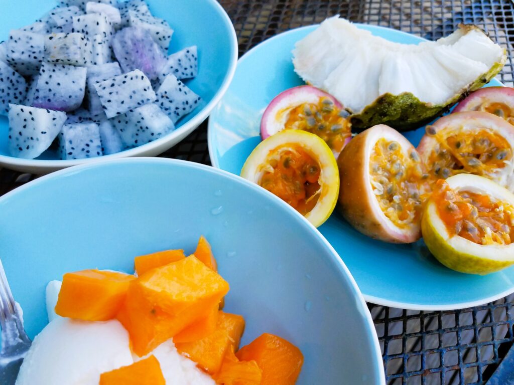 cut up dragronfruit, passionfruit, cherimoya, and papaya