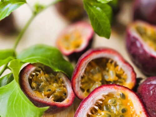 Passionfruit cut in half to show the pulp and seeds