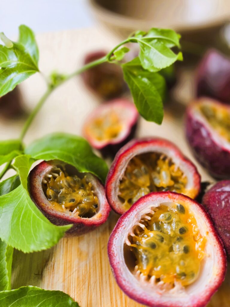 Passionfruit cut in half to show the pulp and seeds